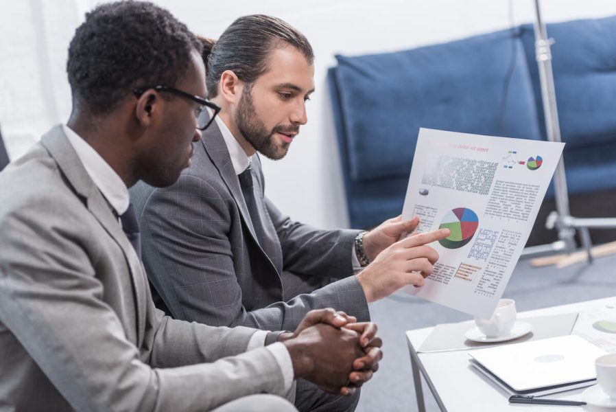 multiethnic-business-partners-looking-at-document-2024-11-18-03-51-08-utc.jpg